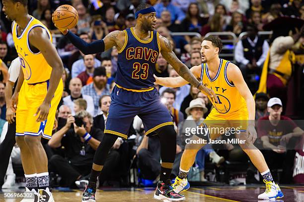 LeBron James of the Cleveland Cavaliers posts up against Klay Thompson of the Golden State Warriors during the first half at Quicken Loans Arena on...