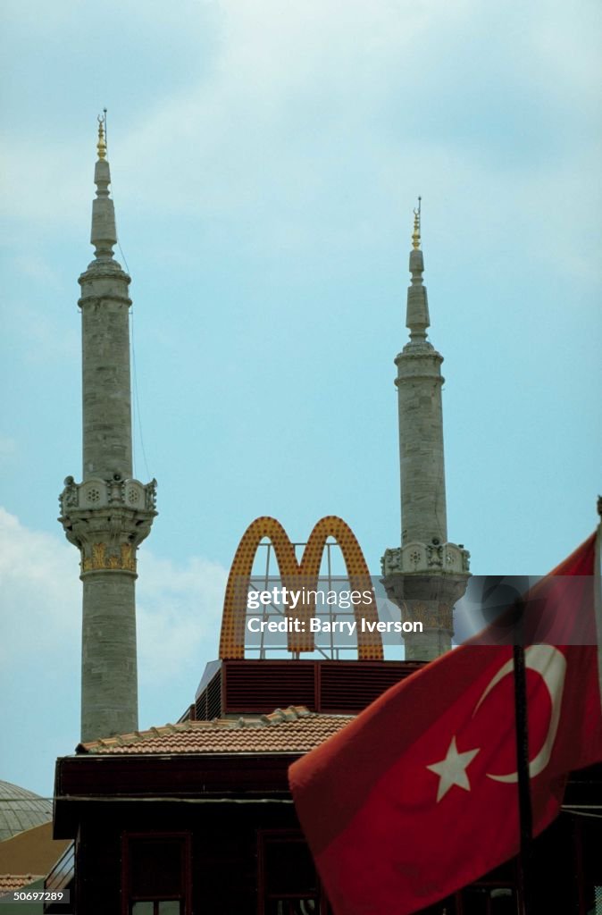 Turkish flag in front of mosque minarets