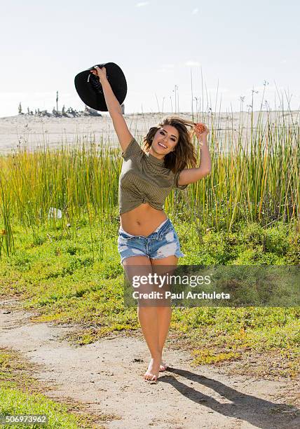 Actress Mayra Leal poses for a photos on the beach in Malibu on January 26, 2016 in Los Angeles, California.