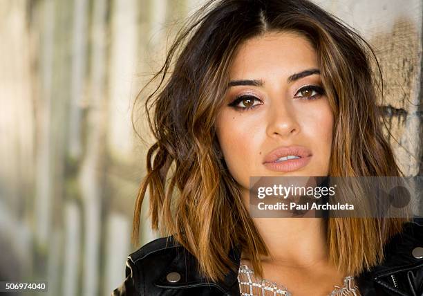 Actress Mayra Leal poses for a photos on the beach in Malibu on January 26, 2016 in Los Angeles, California.