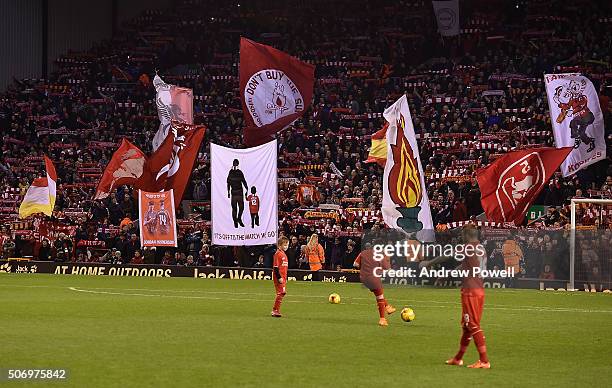 Liverpool fans wave banners and flags before the Capital One Cup Semi Final: Second Leg between Liverpool and Stoke City at Anfield on January 26,...