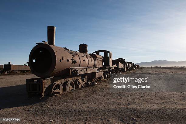 Kilometer long line of old steam locomotives and carriages lie in the Uyuni desert. It was built by British engineers at the end of the 19th century....