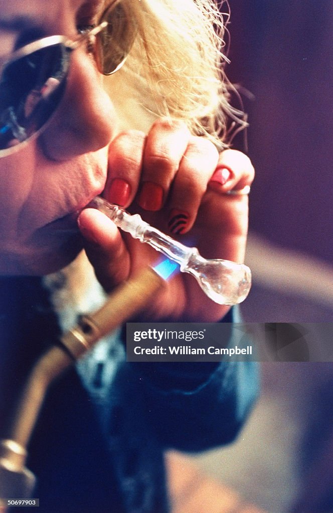 Woman smoking crank (methamphetamine) th