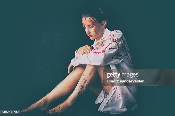 sad girl covered in bloodstains - white shirt stain stock pictures, royalty-free photos & images