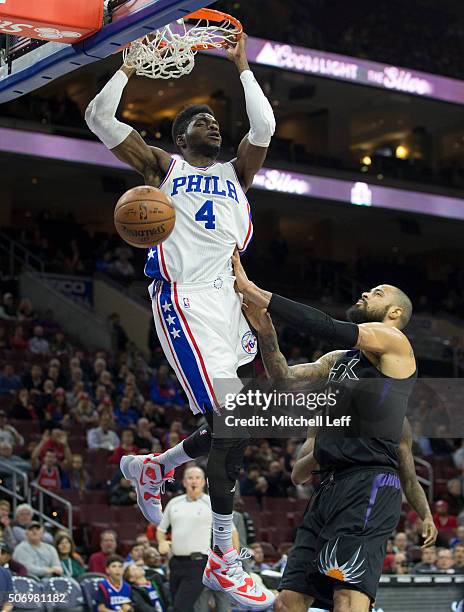 Nerlens Noel of the Philadelphia 76ers dunks the ball past Tyson Chandler of the Phoenix Suns on January 26, 2016 at the Wells Fargo Center in...