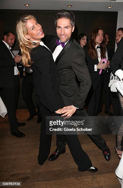 Giulia Siegel and Christian Polanc dances during the Smoking Cocktail at Kaefer Atelier on January 26, 2016 in Munich, Germany.