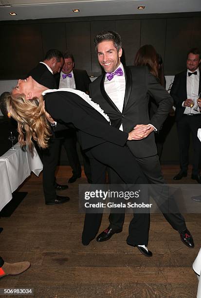 Giulia Siegel and Christian Polanc dances during the Smoking Cocktail at Kaefer Atelier on January 26, 2016 in Munich, Germany.