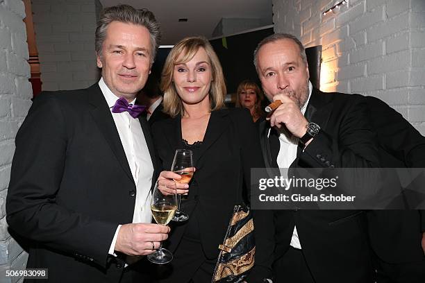 Timothy Peach, Saskia Valencia and Thomas Darchinger smokes during the Smoking Cocktail at Kaefer Atelier on January 26, 2016 in Munich, Germany.