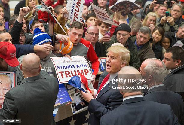 Republican presidential candidate Donald Trump greets guests at a rally on January 26, 2016 in Marshalltown, Iowa. Sheriff Joe Arpaio, the...