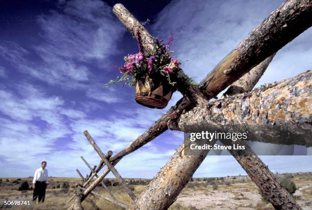 Basket of flowers hanging from fence where Matthew Shepard, openly gay Univ. Of Wyoming student, was left tied, beaten near death in savage assault...