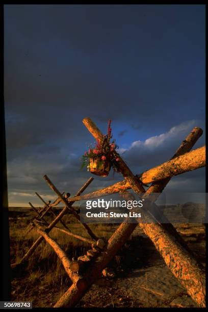 Basket of flowers hangs from fence where Matthew Shepard, an openly gay Univ. Of Wyoming student, was tied & beaten in savage assault by alleged...