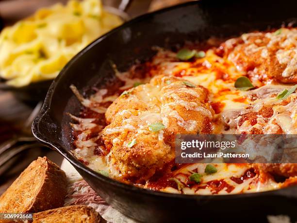 chicken parmesan baked in tomato sauce with mozzarella cheese - parmesan cheese stock pictures, royalty-free photos & images