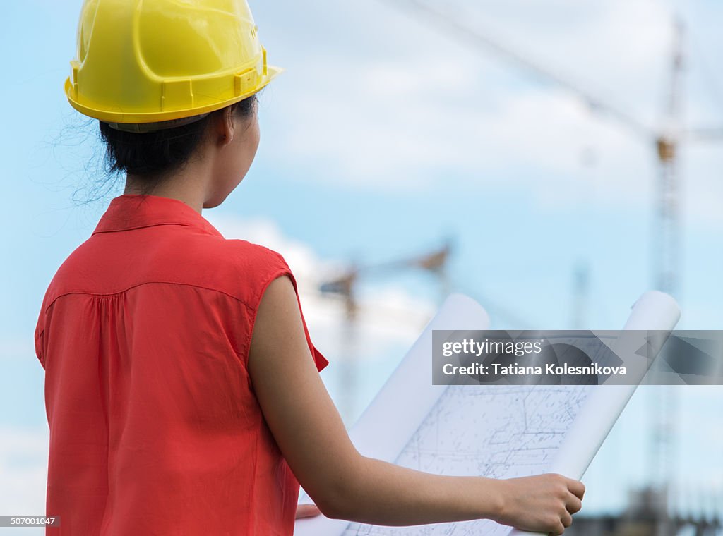 Female designer on construction site.