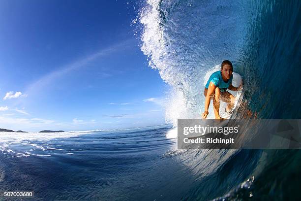 close up of surfer in barrel - surf girl stock pictures, royalty-free photos & images