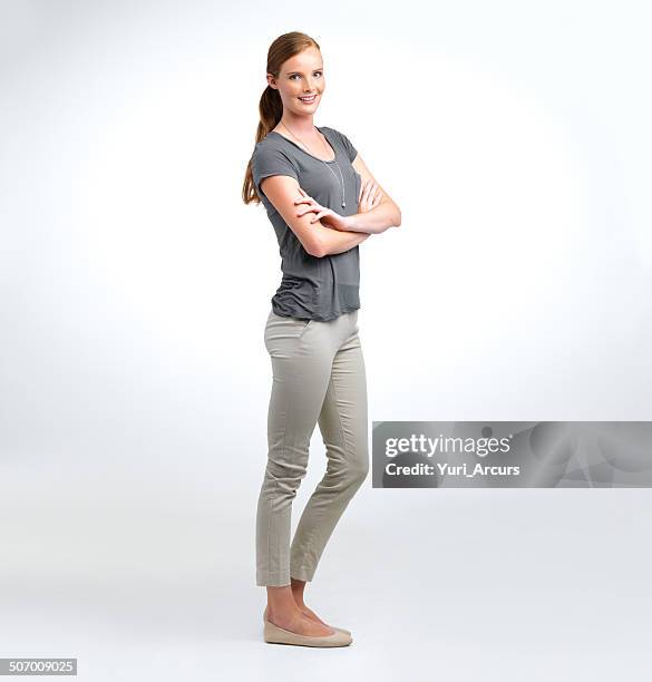 young and confident - standing arms crossed stock pictures, royalty-free photos & images