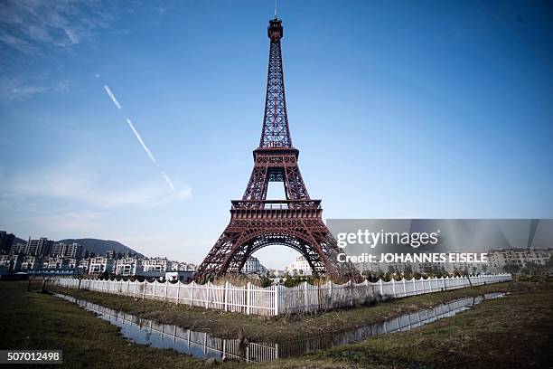 This picture taken on January 26, 2016 shows a replica of the Effel Tower in Tianducheng, a luxury real estate development located in Hangzhou in...