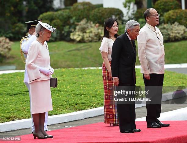 Japan's Emperor Akihito and his wife Empress Michiko stand with Philippine President Benigno Aquino and his sister Aurora Corazon Aquino-Abellada as...