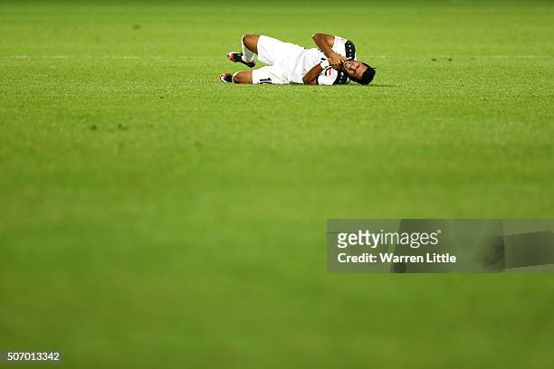 Faisal Hisny Ali of Iraq lies injured during the AFC U-23 Championship semi final match between Japan and Iraq at the Abdullah Bin Khalifa Stadium on...