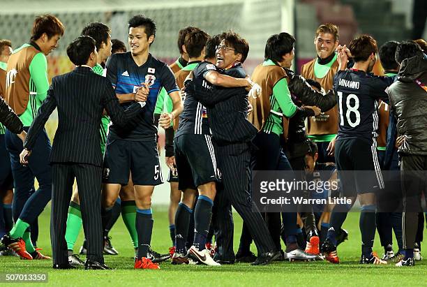 Makoto Teguramori, Head Coach of Japan congraulated his players after winning the AFC U-23 Championship semi final match between Japan and Iraq at...