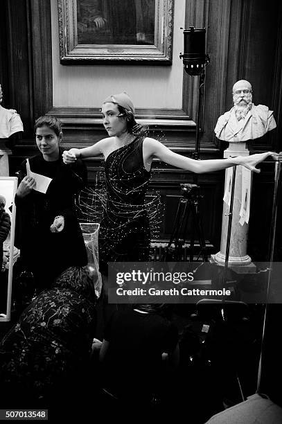 Model is dressed backstage before the Yiqing Yin show as part of Paris Fashion Week Haute Couture Spring/Summer 2015 on January 26, 2015 in Paris,...