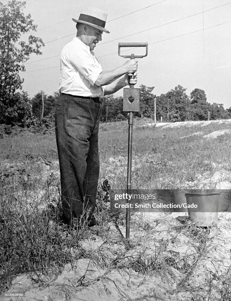 Worker Performing A Moisture Test
