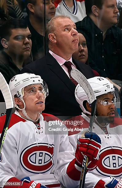 Montreal Canadiens coach Michel Therrien watches the video board during game action against the Toronto Maple Leafs on January 23, 2016 at Air Canada...