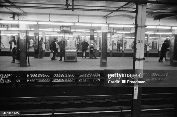 Commuters wait for trains at Pennsylvania Station, New York City, USA, 1966.