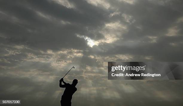 Alvaro Quiros of Spain plays his second shot on the 15th hole during the first round of the Commercial Bank Qatar Masters at Doha Golf Club on...