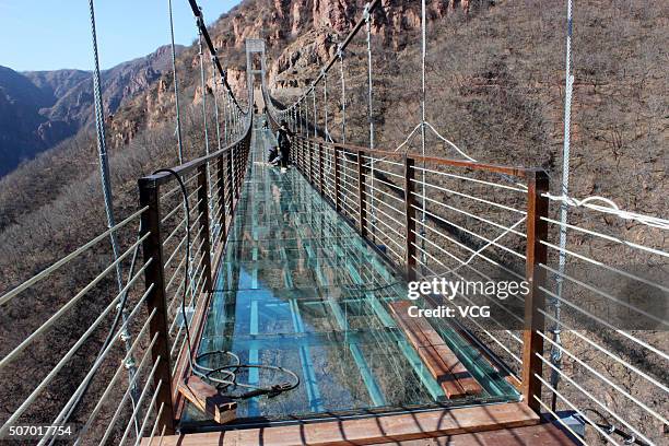 Glass suspension bridge is seen to be completed totally at Fuxishan Tourism Resort on January 26, 2016 in Zhengzhou, Henan Province of China. The...