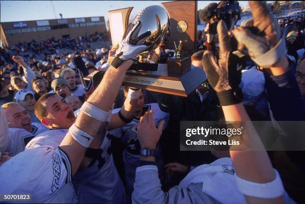 State football championship celebrated at Columbine High School in revival of school spirit despite scars left from last April's massacre by student...