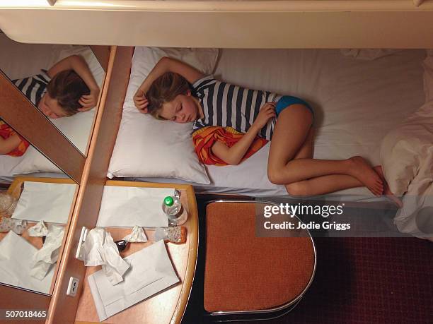 child resting on bunk bed on board passenger ferry - kids in undies stock-fotos und bilder