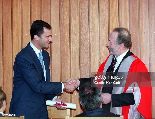 Spain's Prince Felipe shaking hands with Professor Brian Johnson , Master of Fitzwilliam College, during ceremony where he was made Patron of the...