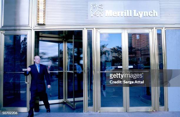 Man exiting Merrill Lynch bldg.