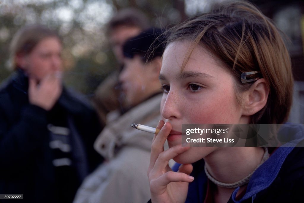 Teenage girl smoking cigarette