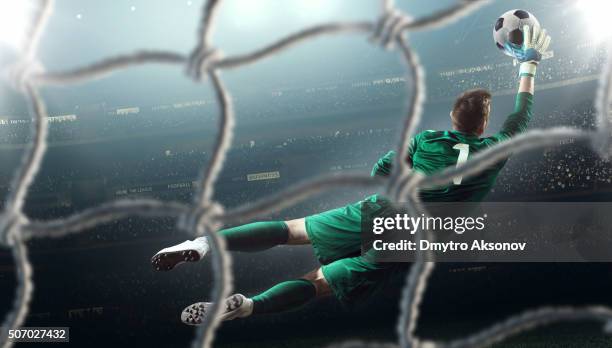 soccer game moment with goalkeeper - kicking goal stock pictures, royalty-free photos & images