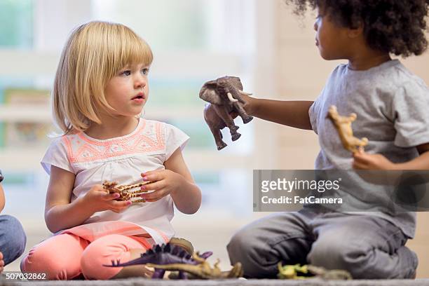 sharing toys - kind stock pictures, royalty-free photos & images