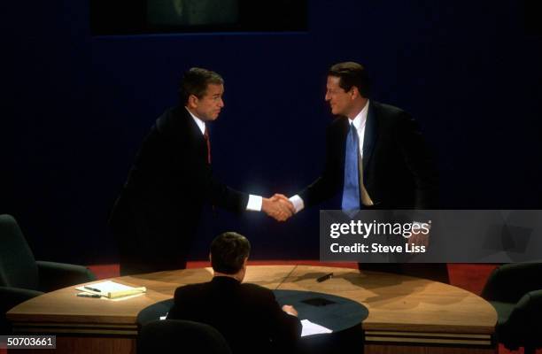 Presidential candidates Gov. George W. Bush & VP Al Gore shaking hands at end of their second campaign debate at Wake Forest University.