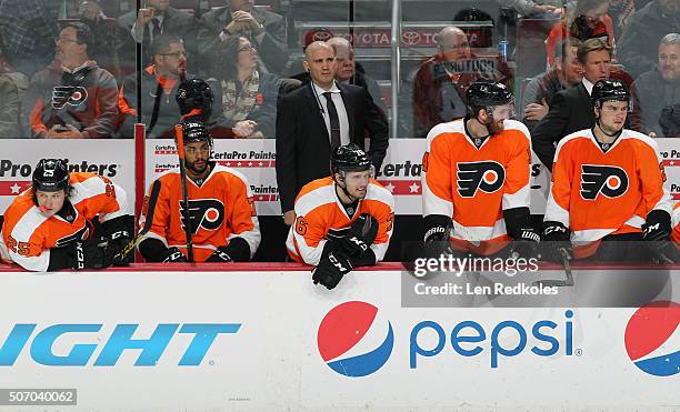 Ryan White, Pierre-Edouard Bellemare, Assistant Coach Ian Laperriere, Chris VandeVelde, Sean Couturier, Scott Laughton and Head Coach Dave Hakstol of...