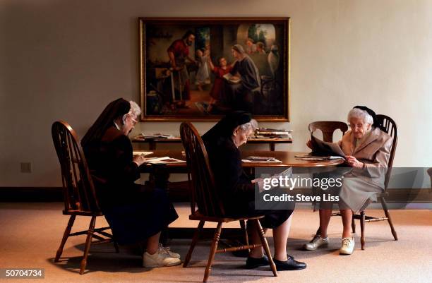 The Nun Study subjects Sisters Alcantara Claverine and Nicolette reading in the Community Room in at the School Sisters of Notre Dame convent where...