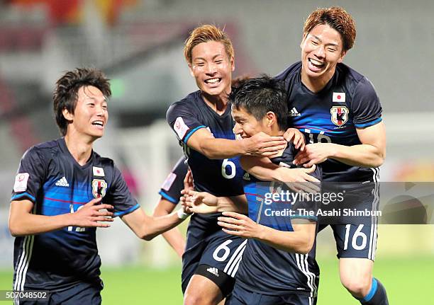 Riki Harakawa of Japan celebrates scoring his team's second goal with his team mates during the AFC U-23 Championship semi final match between Japan...