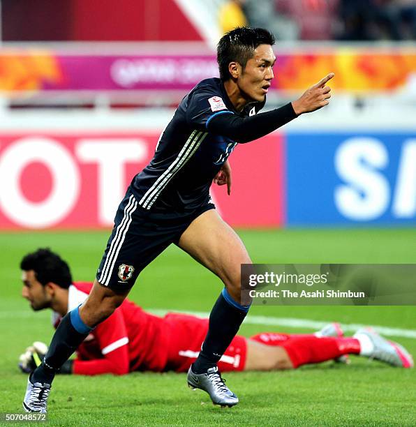 Yuya Kubo of Japan celebrates scoring his team's first goal during the AFC U-23 Championship semi final match between Japan and Iraq at the Abdullah...