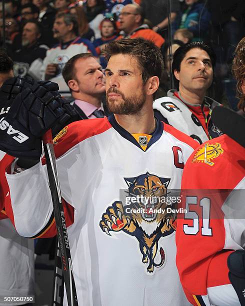 Willie Mitchell of the Florida Panthers stands for the singing of the national anthem prior to the game against the Edmonton Oilers on January 10,...