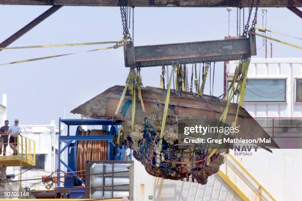 Navy divers, working w. Archaeologists fr. The National Oceanic and Atmospheric Administration on the Manson Gulf Derrick Barge WOTAN, recovering...