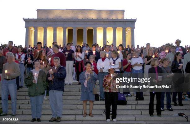 Mourners burning candles during a vigil at the Lincoln memorial to remeber those who died in the terrorist attack on September 11, 2001.