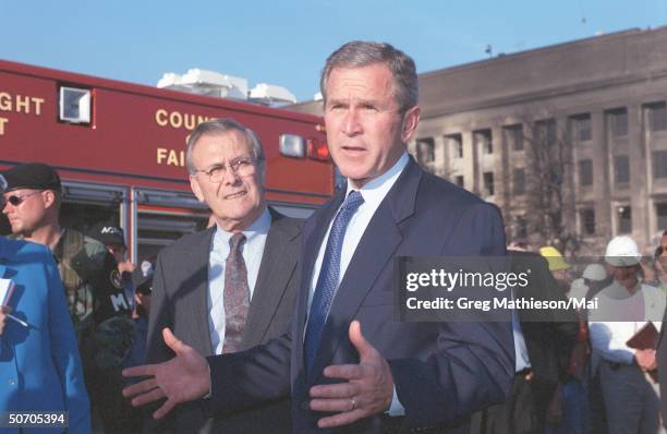 President George W. Bush & Secretary of Defense Donald Rumsfeld visiting the Pentagon one day after high-jacked Flight 77, an American Airlines...