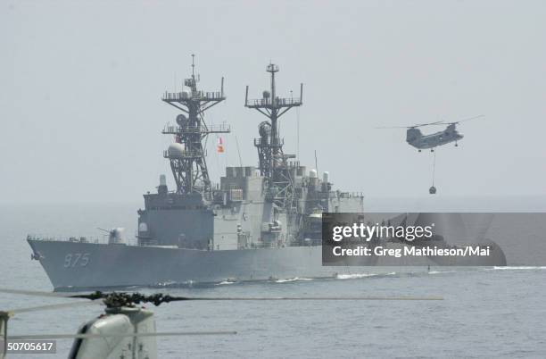 Navy Spruance Class destroyer USS O'Brien receiving a load of palatized cargo for delivery to other ships in the battle group.