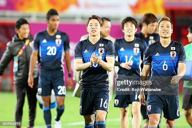 Takuma Asano and Japanese players celebrate qualifying for the Rio de Janeiro Olympics after winning the AFC U-23 Championship semi final match...