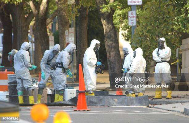 Marines with the Chemical Biological Incident Responce Force working in hazmat gear as they decontaminate the Longworth House Office building of...