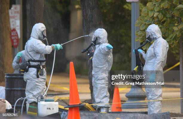 Marines with the Chemical Biological Incident Responce Force working in hazmat gear as they decontaminate the Longworth House Office building of...