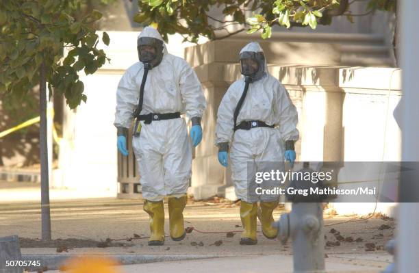 Marines with the Chemical Biological Incident Responce Force working in hazmat gear as they decontaminate the Longworth House Office building of...